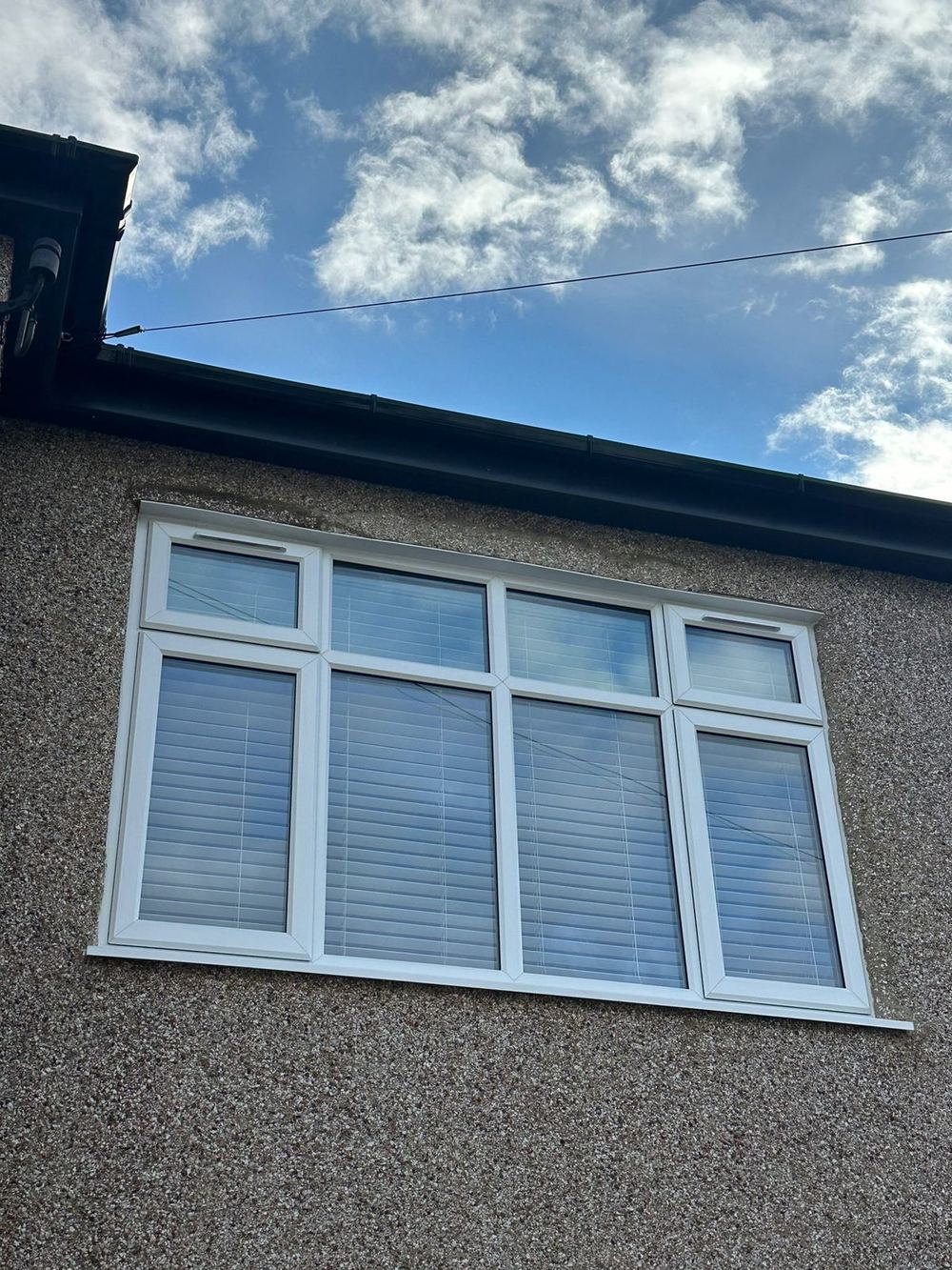 Rehau Total 70 casement window with top-hung transom vent, white uPVC frame